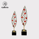 Metal Leaf With Stone Statue