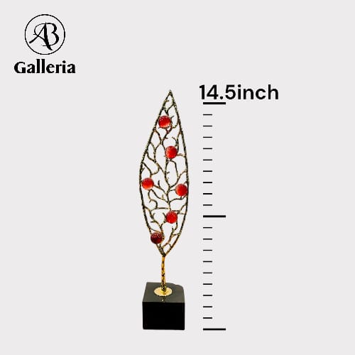 Metal Leaf With Stone Statue